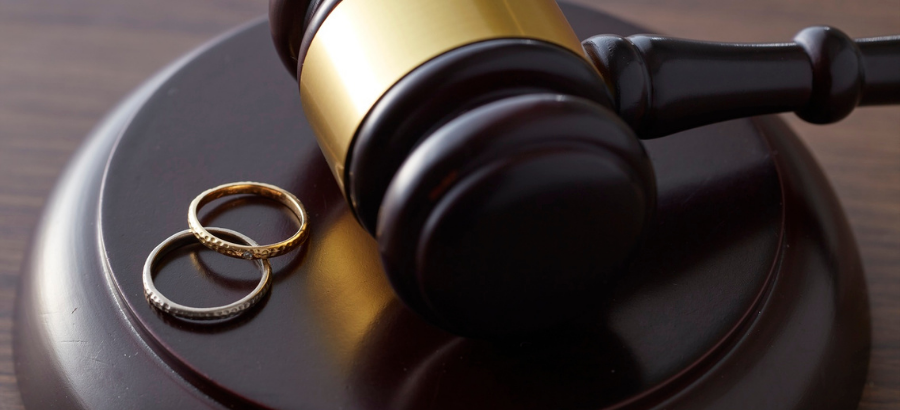 Gavel with two wedding rings