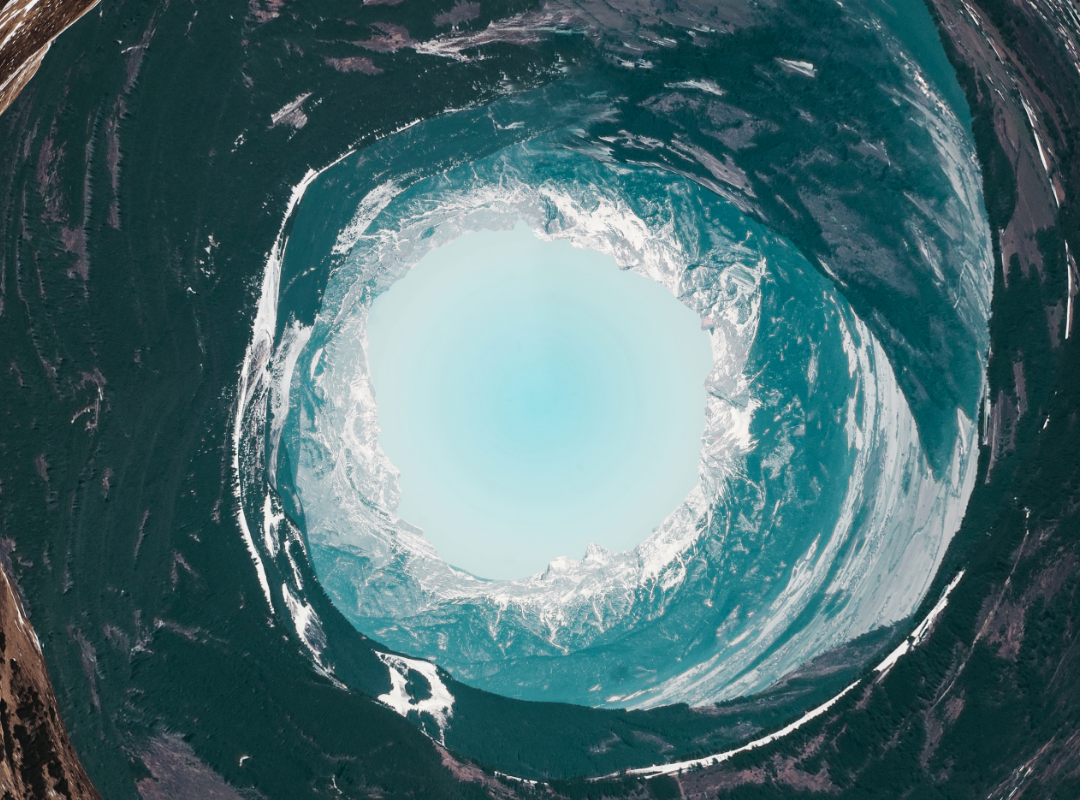 Tunnel looking into icy landscape