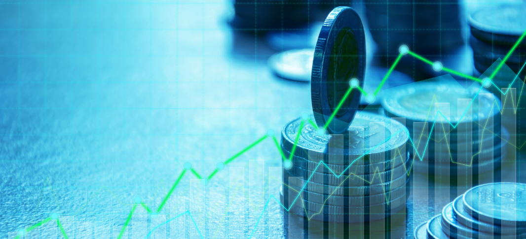 A graph with an image of stacked coins behind it 