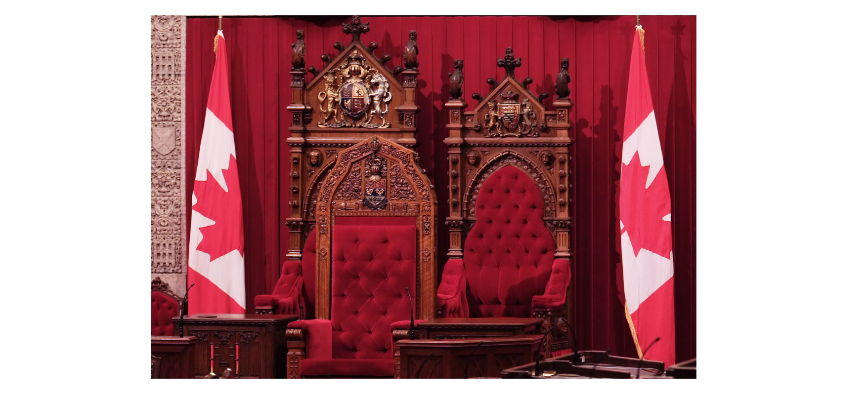 Three chairs in the senate chamber