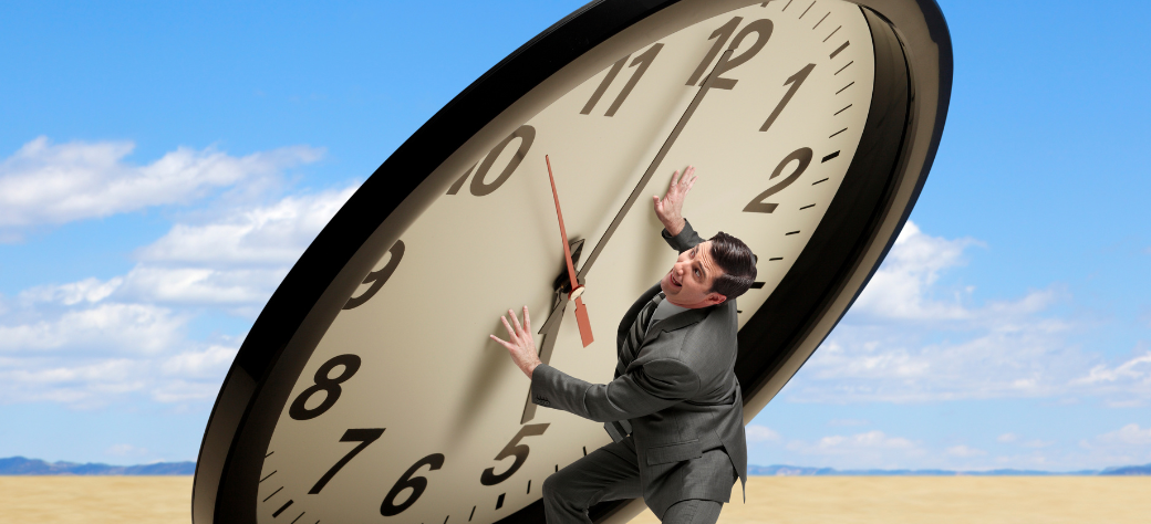 Man Holding Up A Giant Clock That is Falling On Him 