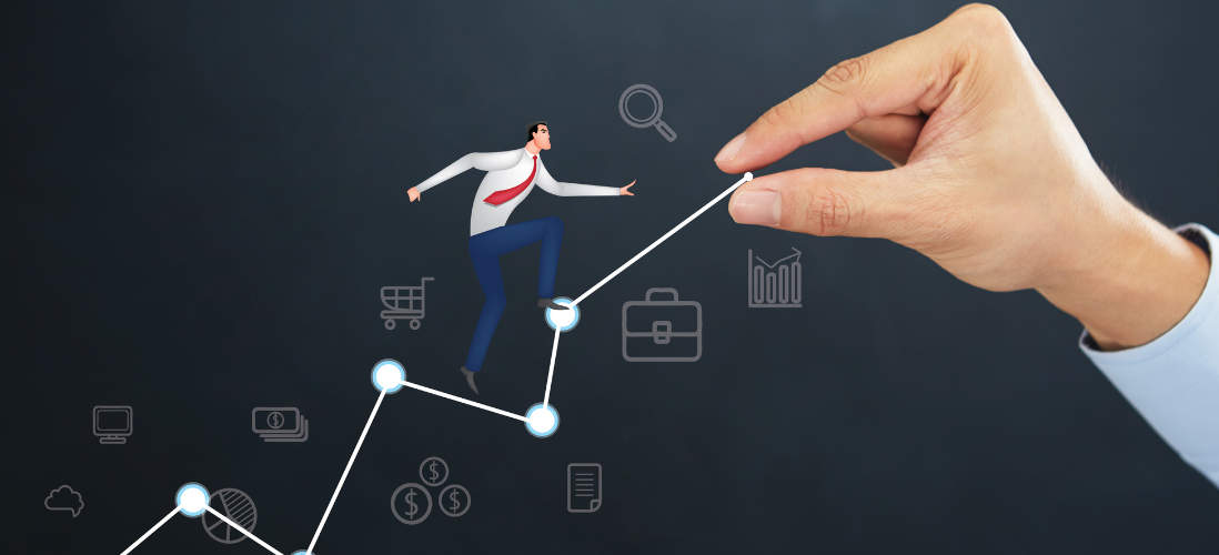 A small suited man climbs a bar graph being drawn at the hand of an employer